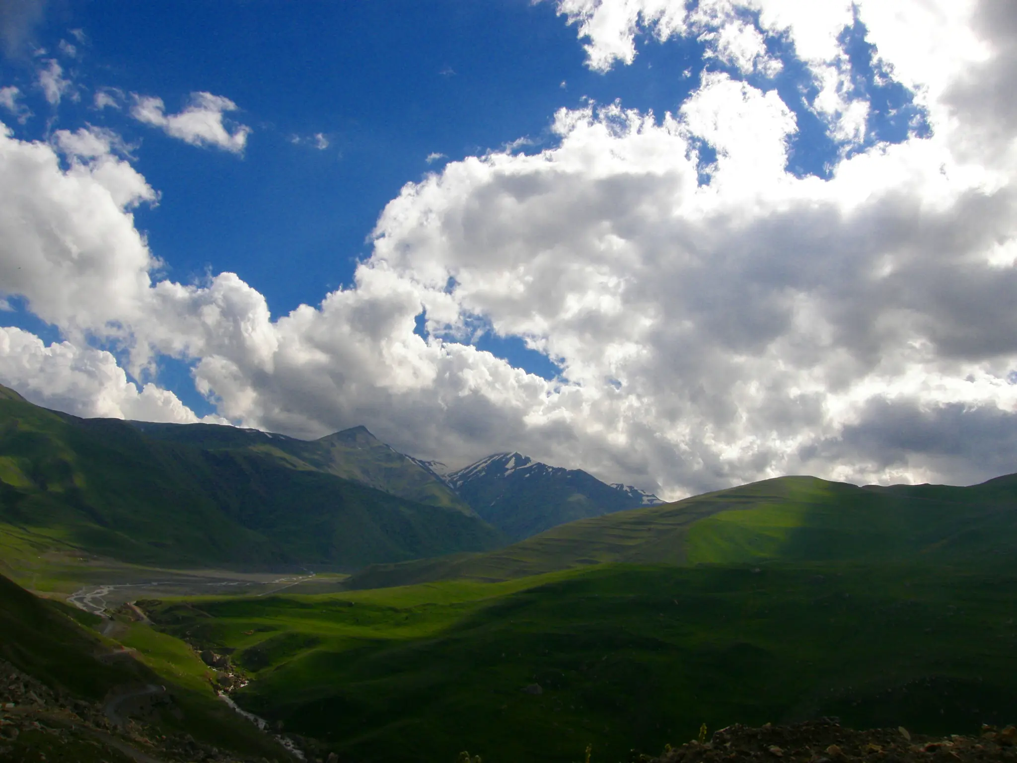 Green valleys and Caucasus peaks seen from Khinalig village