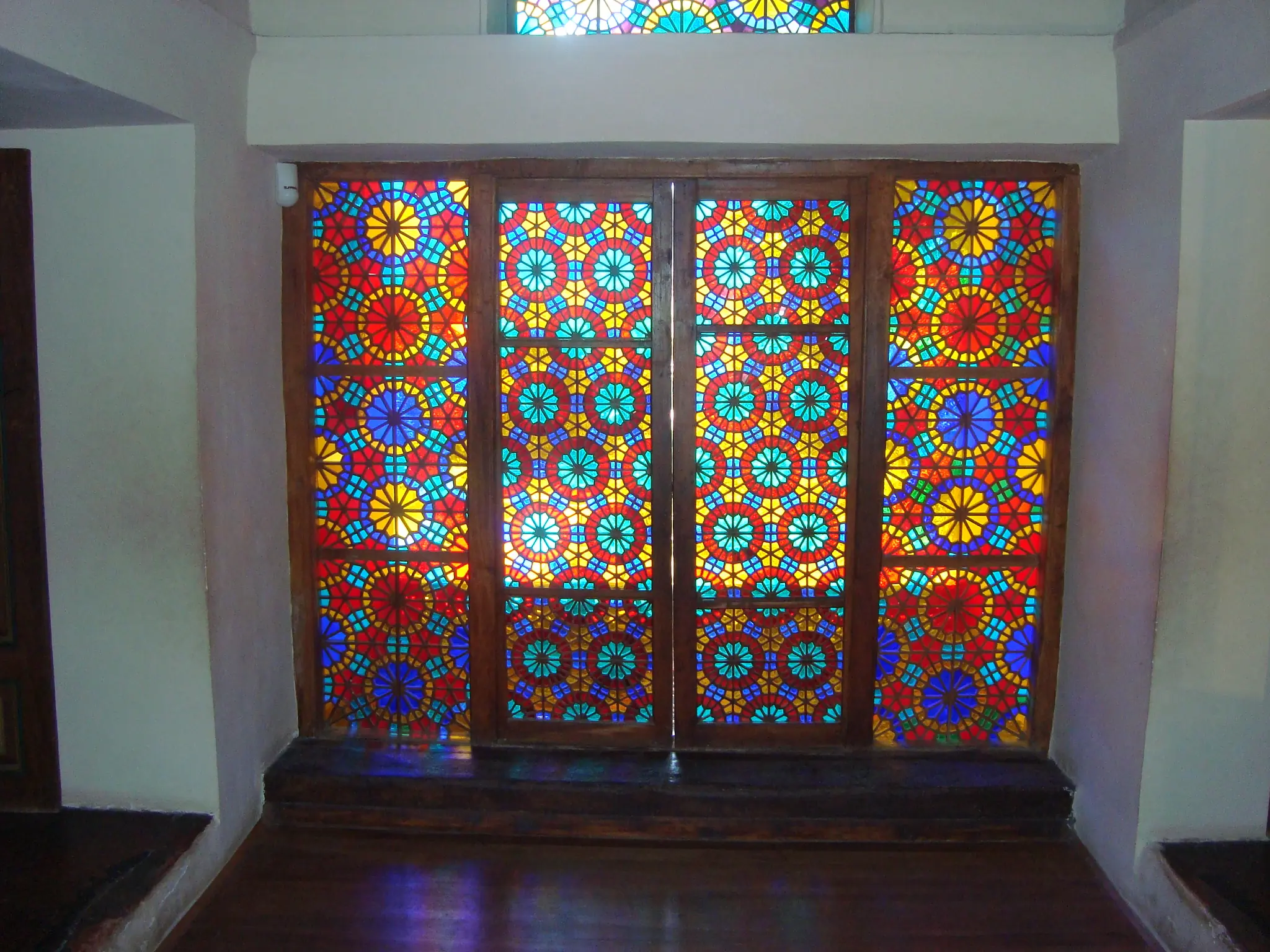 Şəbəkə window of coloured glass in a wooden lattice, Sheki Khan's Palace